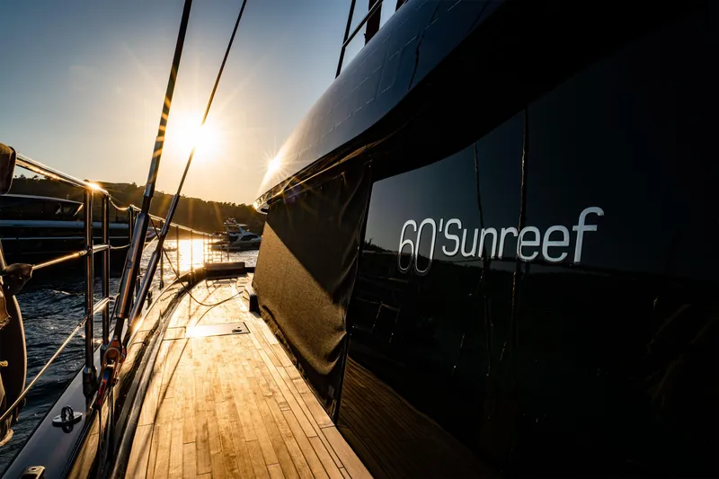  Yacht Photos Pics 2024 Sunreef 60 Eco yacht at sunset, showcasing sleek design and luxury.
