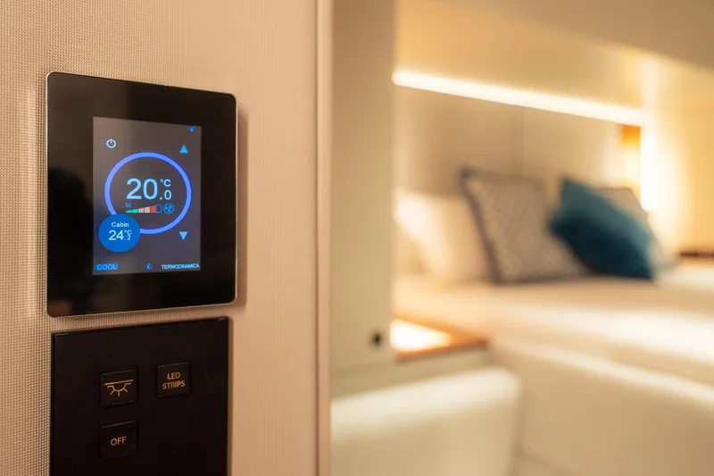  Yacht Photos Pics Smart thermostat in Sunreef 60 Eco yacht cabin, 2024 model, displaying temperature settings.
