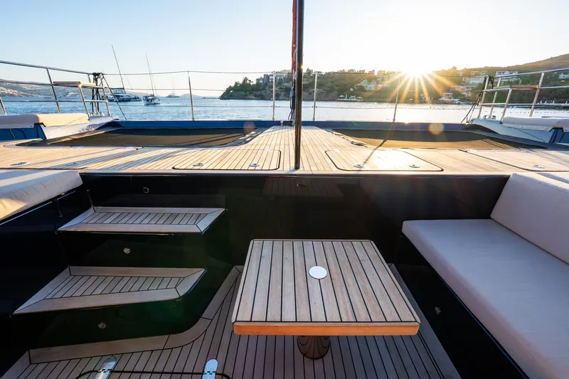  Yacht Photos Pics Luxurious 2024 Sunreef 60 Eco yacht deck with sunset view over calm waters.