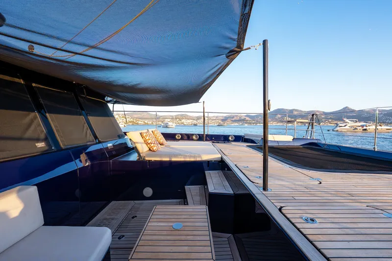  Yacht Photos Pics Luxurious Sunreef 60 Eco yacht deck with seating, overlooking serene waters and distant mountains.