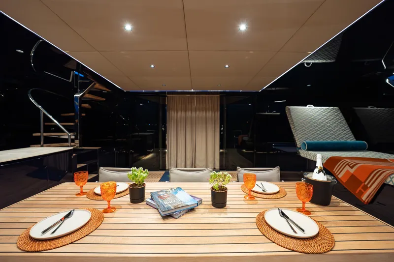  Yacht Photos Pics Luxurious dining area on 2024 Sunreef 60 Eco yacht, featuring elegant table setting and modern decor.