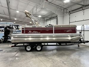 2024 Sun Tracker PARTY BARGE® 20 DLX pontoon boat in showroom.
