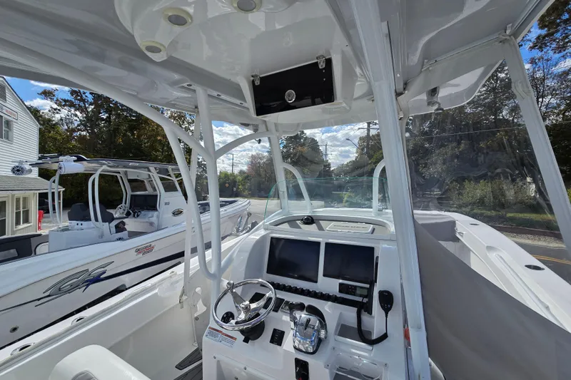  Yacht Photos Pics 2021 Twin Vee 310 CC GF boat interior with modern controls and navigation screens.