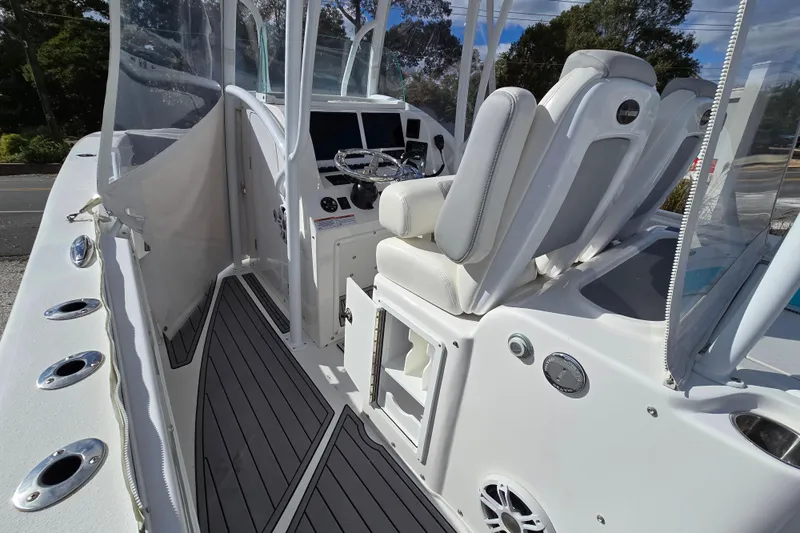  Yacht Photos Pics 2021 Twin Vee 310 CC GF boat interior with helm and seating area.