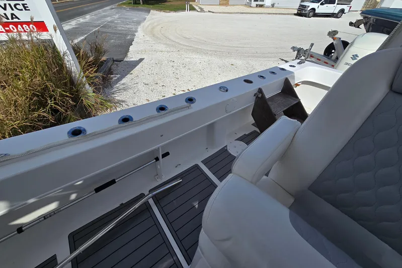  Yacht Photos Pics 2021 Twin Vee 310 CC GF boat interior with seating and rod holders.