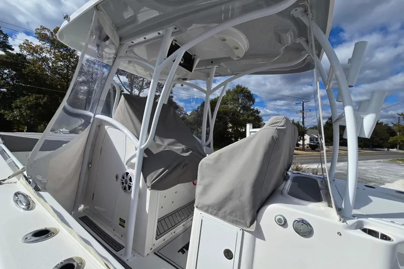  Yacht Photos Pics 2021 Twin Vee 310 CC GF boat with covered seating and clear canopy.