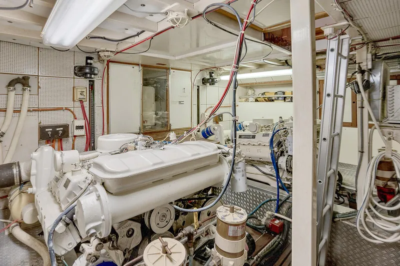 30 West Yacht Photos Pics Engine room of a 1991 Grand Banks 49 Classic yacht, showcasing mechanical components and wiring.