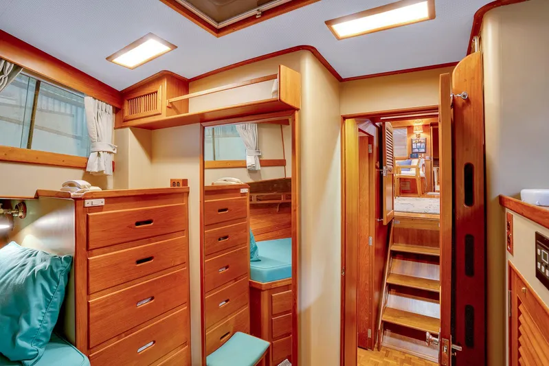 30 West Yacht Photos Pics Interior of 1991 Grand Banks 49 Classic yacht with wooden cabinetry and cozy sleeping area.