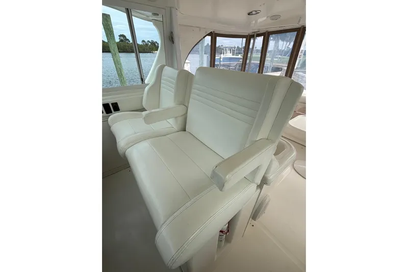  Yacht Photos Pics Luxurious white seating on 2004 Sea Ray 480 Sedan Bridge yacht, featuring panoramic windows.