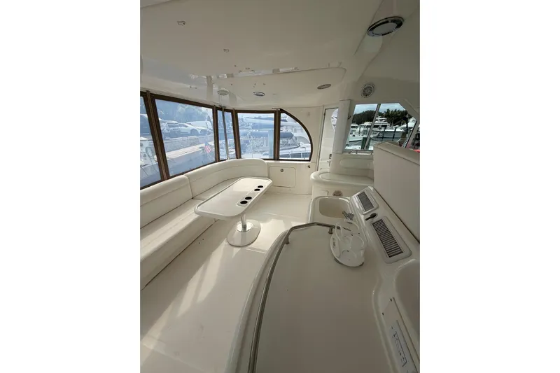  Yacht Photos Pics Luxurious interior of 2004 Sea Ray 480 Sedan Bridge yacht with panoramic windows.