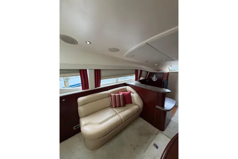  Yacht Photos Pics Luxurious interior of 2004 Sea Ray 480 Sedan Bridge yacht with plush seating and elegant design.