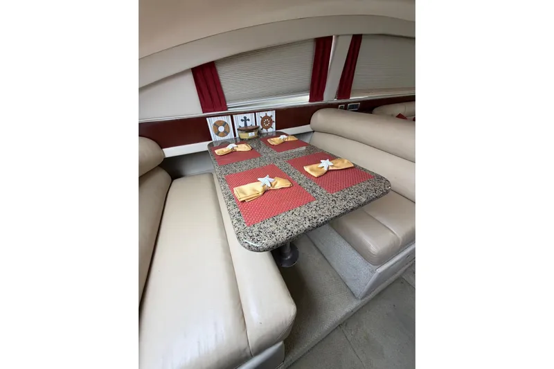  Yacht Photos Pics Luxurious dining area on 2004 Sea Ray 480 Sedan Bridge yacht with elegant table setting.