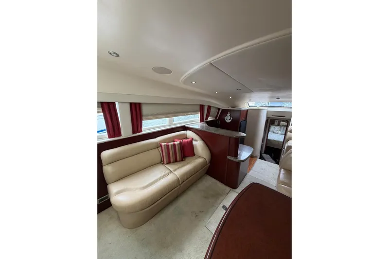  Yacht Photos Pics Luxurious interior of 2004 Sea Ray 480 Sedan Bridge yacht with elegant seating and decor.