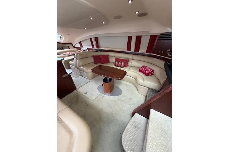  Yacht Photos Pics Luxurious interior of 2004 Sea Ray 480 Sedan Bridge with plush seating and elegant decor.