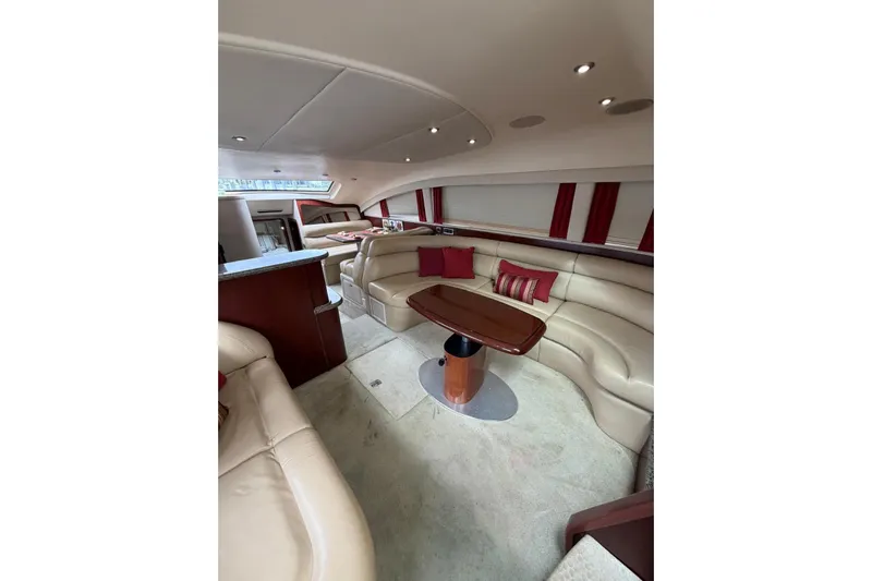  Yacht Photos Pics Luxurious interior of 2004 Sea Ray 480 Sedan Bridge with plush seating and elegant design.