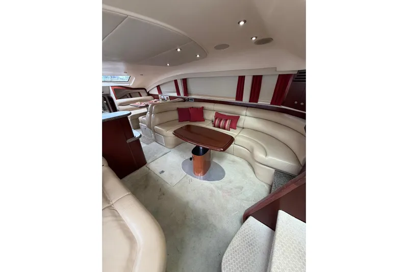  Yacht Photos Pics Luxurious interior of 2004 Sea Ray 480 Sedan Bridge with plush seating and elegant design.