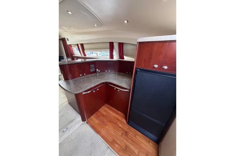  Yacht Photos Pics Luxurious 2004 Sea Ray 480 Sedan Bridge yacht interior with modern kitchen design.