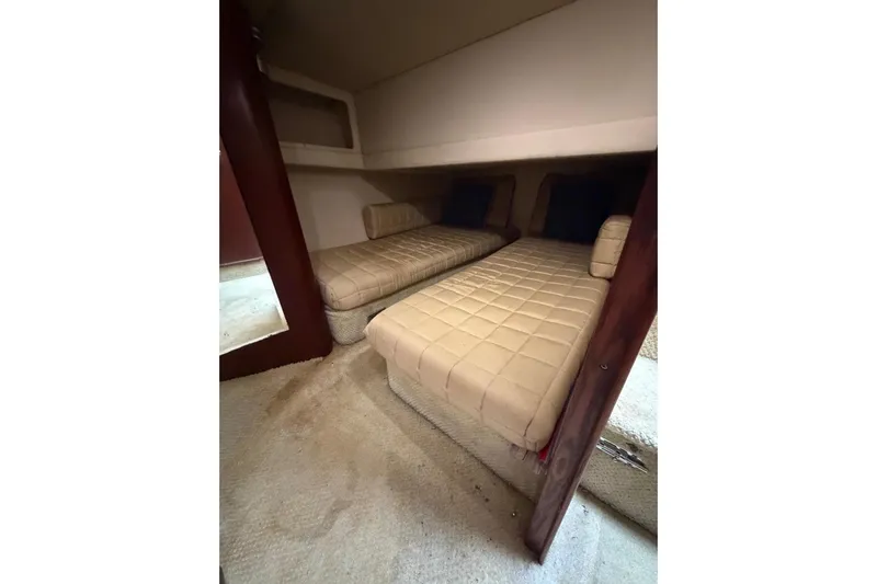  Yacht Photos Pics 2004 Sea Ray 480 Sedan Bridge cabin with twin beds and beige upholstery.