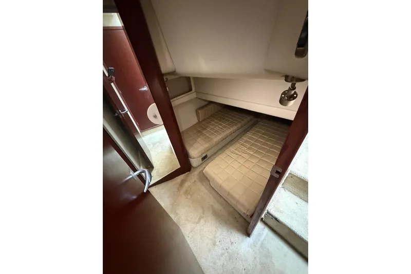  Yacht Photos Pics 2004 Sea Ray 480 Sedan Bridge cabin with twin beds and wooden interior.