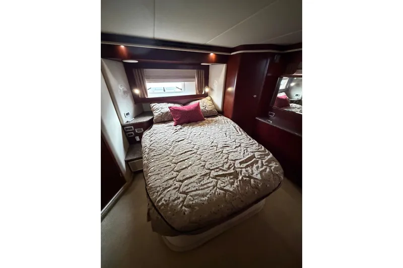  Yacht Photos Pics Luxurious bedroom interior of 2004 Sea Ray 480 Sedan Bridge yacht.
