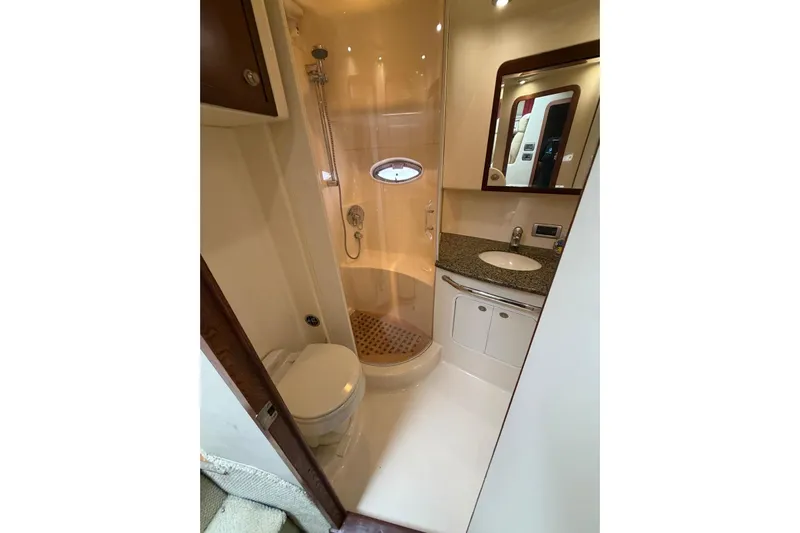  Yacht Photos Pics Luxurious bathroom in 2004 Sea Ray 480 Sedan Bridge yacht with shower and vanity.