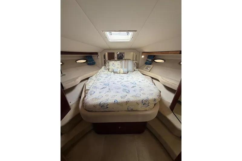  Yacht Photos Pics 2004 Sea Ray 480 Sedan Bridge cabin interior with cozy bed and elegant decor.