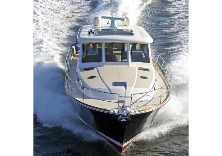 Vertical Yacht Photos Pics 2017 Sabre 48 Salon Express cruising on water, front view.