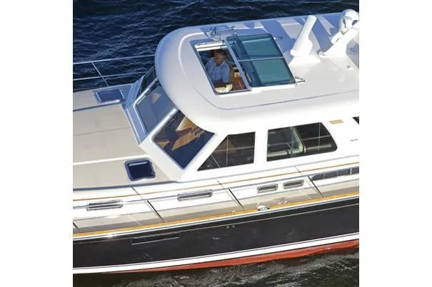 Vertical Yacht Photos Pics 2017 Sabre 48 Salon Express yacht cruising on water.