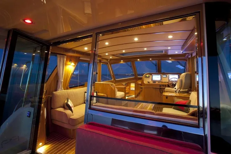 Vertical Yacht Photos Pics Luxurious interior of 2017 Sabre 48 Salon Express yacht at dusk.