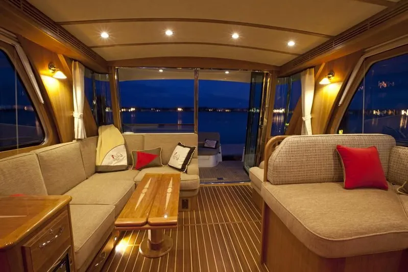 Vertical Yacht Photos Pics Luxurious interior of 2017 Sabre 48 Salon Express yacht with elegant seating and ambient lighting.