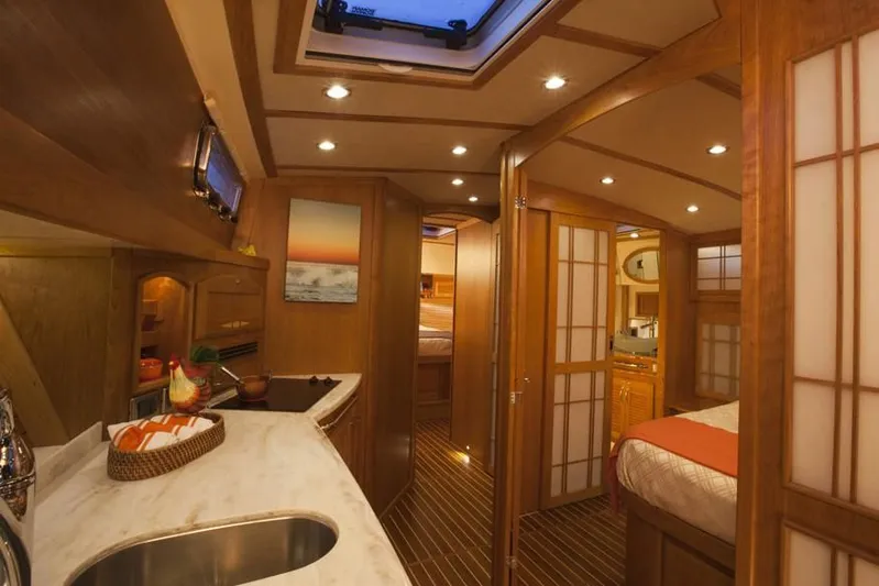 Vertical Yacht Photos Pics Interior of 2017 Sabre 48 Salon Express yacht, featuring elegant wood finishes and modern amenities.