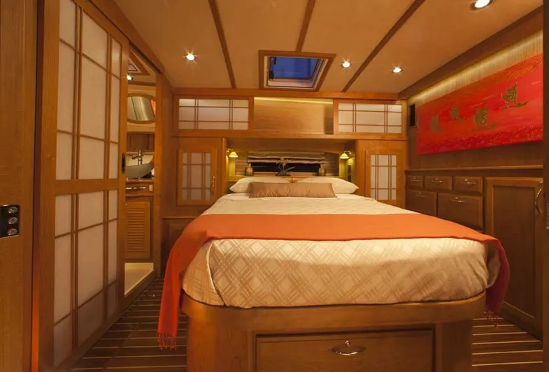 Vertical Yacht Photos Pics Luxurious 2017 Sabre 48 Salon Express cabin with elegant wood interior and cozy bedding.