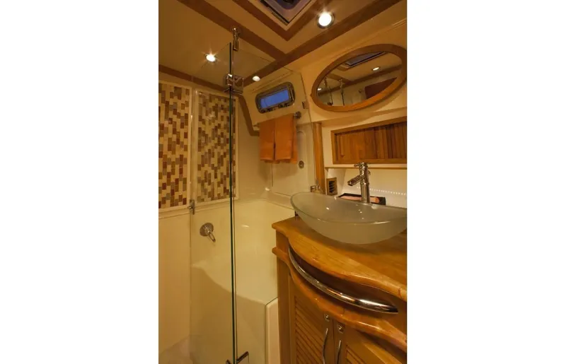 Vertical Yacht Photos Pics Luxurious bathroom in 2017 Sabre 48 Salon Express yacht with modern fixtures and wood accents.