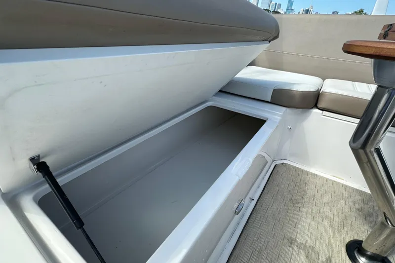  Yacht Photos Pics Open storage compartment on 2019 Regal 42 Fly boat with cushioned seating.