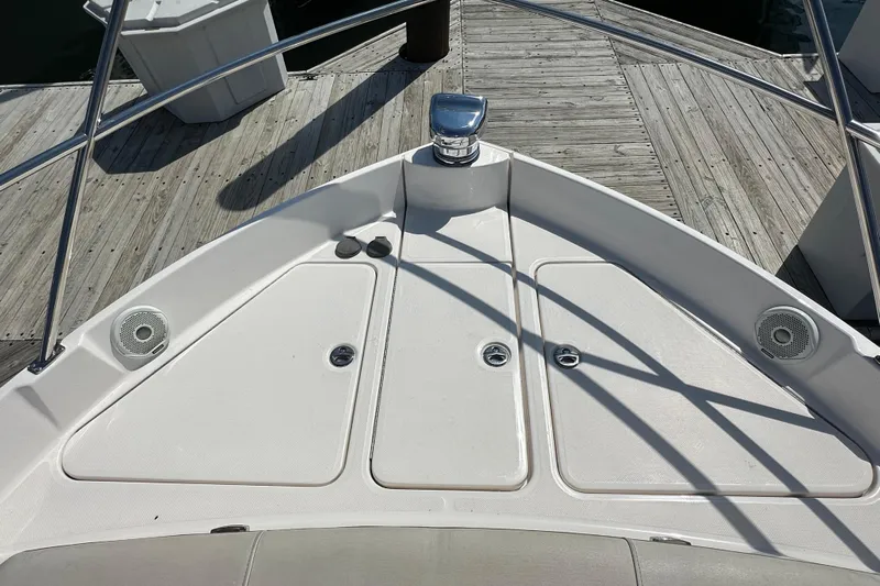  Yacht Photos Pics Bow of 2019 Regal 42 Fly yacht at dock, featuring sleek design and speakers.