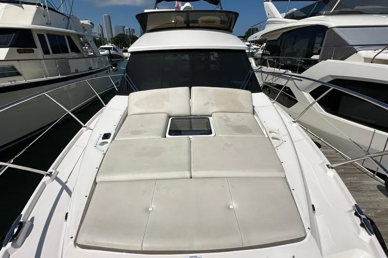  Yacht Photos Pics 2019 Regal 42 Fly yacht with spacious sunbathing deck at marina.