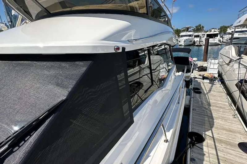  Yacht Photos Pics 2019 Regal 42 Fly yacht docked at marina, showcasing sleek design and modern features.