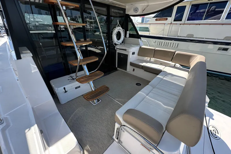  Yacht Photos Pics Luxurious 2019 Regal 42 Fly yacht interior with elegant seating and modern staircase.