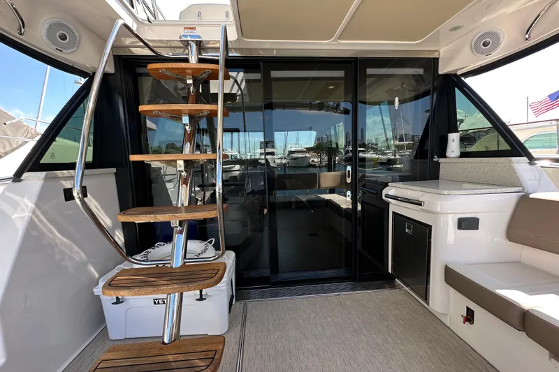  Yacht Photos Pics 2019 Regal 42 Fly yacht interior with wooden stairs and modern amenities.