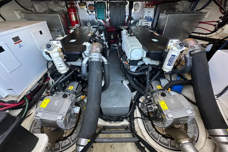  Yacht Photos Pics Engine room of 2019 Regal 42 Fly yacht, showcasing dual engines and mechanical components.
