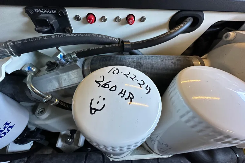  Yacht Photos Pics Engine compartment of 2019 Regal 42 Fly with labeled oil filter and diagnostic port.