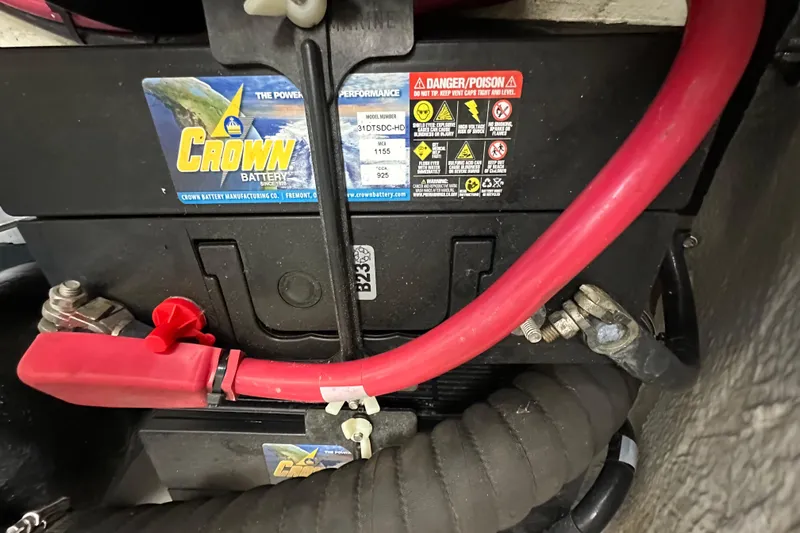  Yacht Photos Pics Battery compartment of a 2019 Regal 42 Fly with Crown battery and red cables.