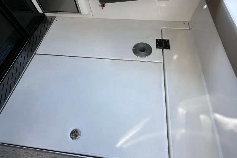  Yacht Photos Pics 2019 Regal 42 Fly yacht deck with storage hatch and metal fittings.