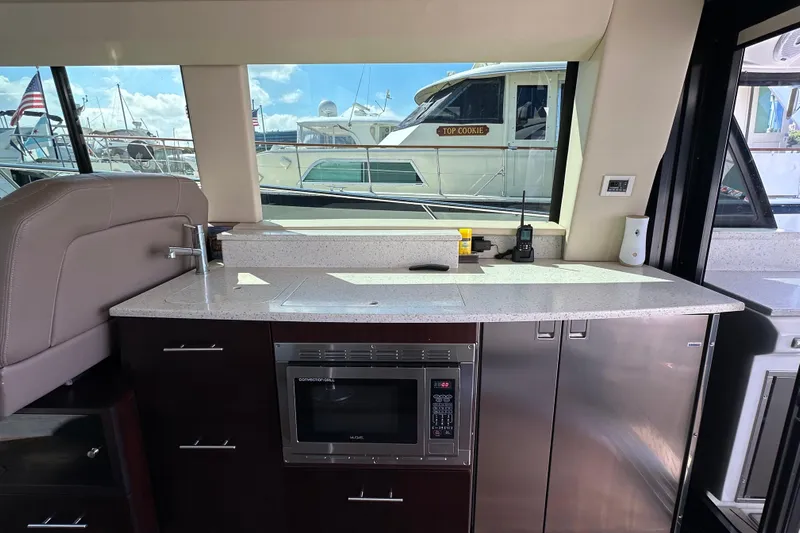  Yacht Photos Pics Luxurious 2019 Regal 42 Fly yacht interior with modern kitchenette and sleek design.