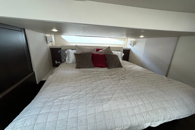  Yacht Photos Pics Luxurious bedroom interior of 2019 Regal 42 Fly yacht with cozy bedding.