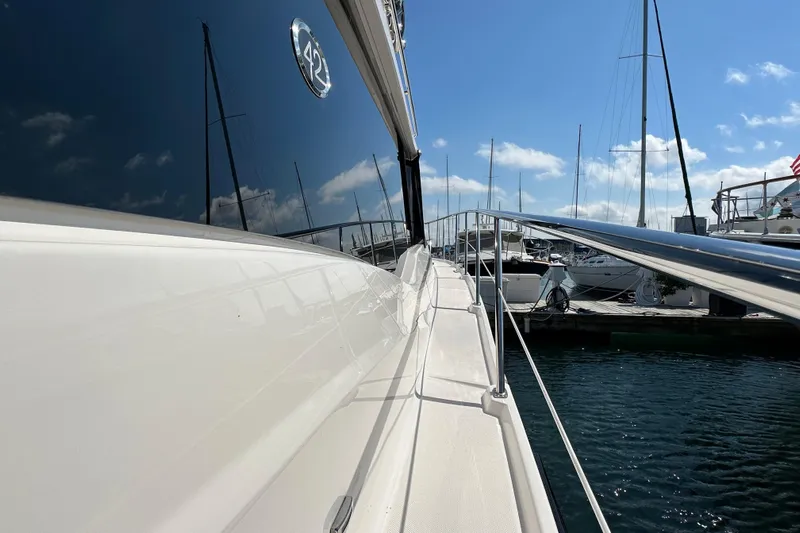  Yacht Photos Pics 2019 Regal 42 Fly yacht docked at marina under clear blue sky.