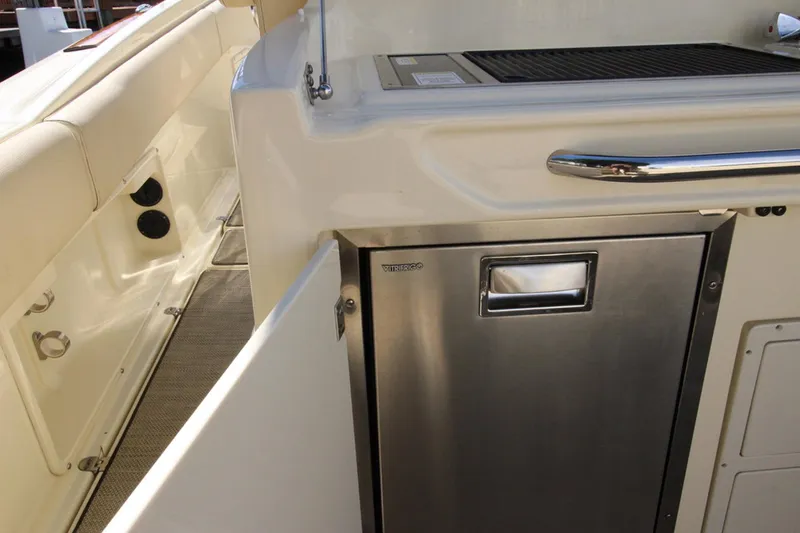 Lilaia Yacht Photos Pics 2020 Chris-Craft Catalina 34 boat interior with stainless steel fridge and grill.