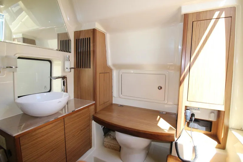 Lilaia Yacht Photos Pics Luxurious bathroom interior of 2020 Chris-Craft Catalina 34 boat with modern fixtures.