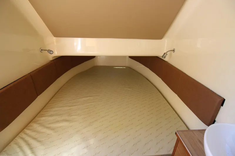 Lilaia Yacht Photos Pics 2020 Chris-Craft Catalina 34 cabin interior with bed and reading lights.