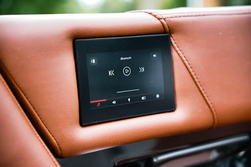  Yacht Photos Pics Touchscreen control panel in 2022 MasterCraft X24 boat, featuring Bluetooth connectivity.